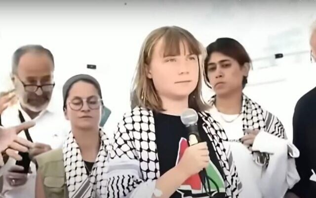 PCPA head Zaher Birawi, left, seen behind activist Greta Thunberg and other flotilla leaders, in a screen capture provided by the Foreign Ministry on September 30, 2025. (Foreign Ministry)