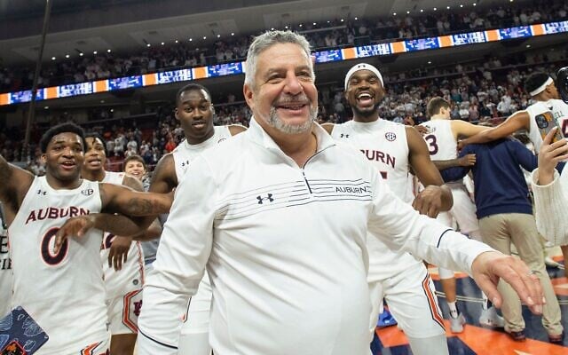 Bruce Pearl celebrates with his team after defeating the Alabama Crimson Tide at Auburn Arena, February 1, 2022. (Michael Chang/Getty Images) Bruce Pearl celebrates with his team after defeating the Alabama Crimson Tide at Auburn Arena, February 1, 2022. (Michael Chang/Getty Images)