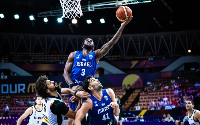 Israel's Khadeen Carrington (3) goes for a bucket over teammate Tomer Ginat (41) and several Belgian defenders during a EuroBasket game in Katowice, Poland, on September 2, 2025. (fiba.basketball) Israel's Khadeen Carrington (3) goes for a bucket over teammate Tomer Ginat (41) and several Belgian defenders during a EuroBasket game in Katowice, Poland, on September 2, 2025. (fiba.basketball)