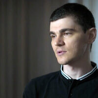 Freed hostage Maxim Herkin speaks to Channel 12 investigative program Uvda in an interview broadcast October 30, 2025. (Screen capture: Channel 12)