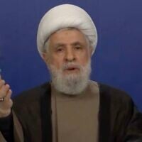 Hezbollah leader Naim Qassem gives a broadcast speech during an event to commemorate the anniversary of Israeli strikes killing two of the Lebanese terror group's military commanders, October 3, 2025. (X screenshot)