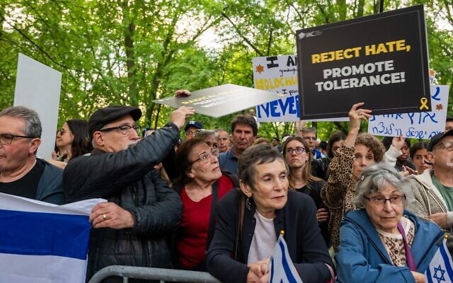 People attend a Holocaust memorial ceremony held a block away from Columbia University amid rallies for and against Israel in New York, May 6, 2024.(Spencer Platt/Getty Images via JTA) People attend a Holocaust memorial ceremony held a block away from Columbia University amid rallies for and against Israel in New York, May 6, 2024.(Spencer Platt/Getty Images via JTA)