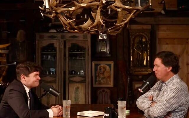 Nick Fuentes sits down for an interview with Tucker Carlson, October 28, 2025. (Screenshot via JTA)