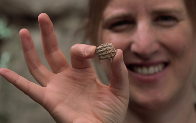 Dr. Ayala Zilberstein, excavation director at the Davidson Archaeological Park in Jerusalem on behalf of the Israel Antiquities Authority, holds a 2,700-year-old pottery fragment bearing the first-ever Assyrian inscription found in the city. The discovery was announced on October 22, 2025. (Emil Aladjem/Israel Antiquities Authority) Dr. Ayala Zilberstein, excavation director at the Davidson Archaeological Park in Jerusalem on behalf of the Israel Antiquities Authority, holds a 2,700-year-old pottery fragment bearing the first-ever Assyrian inscription found in the city. The discovery was announced on October 22, 2025. (Emil Aladjem/Israel Antiquities Authority)