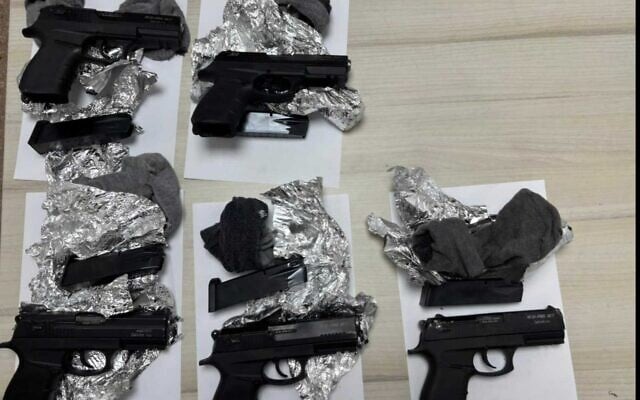 Handguns seized by troops during an attempted smuggling from Syria to Israel, October 6, 2025. (Israel Defense Forces)