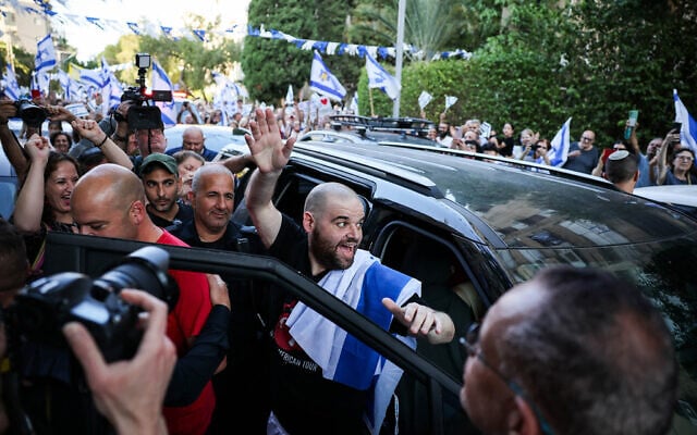 Because of the people Two ex-hostages return home from hospital to cheering crowds