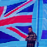 Anti-immigration activist Stephen Yaxley-Lennon, known as Tommy Robinson, speaks during a public address in Tel Aviv, Israel, October 18, 2025. (REUTERS/Ammar Awad)