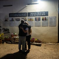 Mourners at a ceremony marking the second anniversary of the Hamas attack on Israel, at Kibbutz Kfar Aza, October 7, 2025. (Luke Tress/Times of Israel)