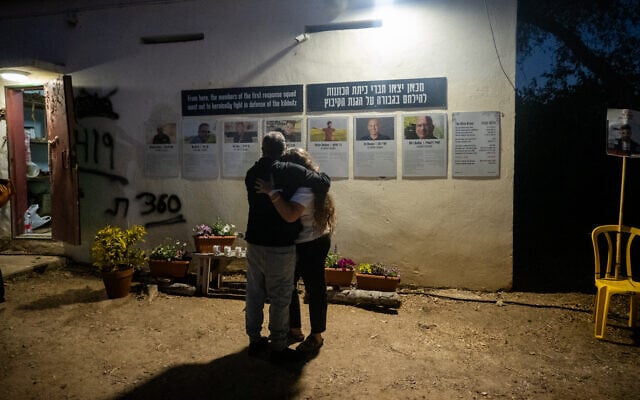 Mourners at a ceremony marking the second anniversary of the Hamas attack on Israel, at Kibbutz Kfar Aza, October 7, 2025. (Luke Tress/Times of Israel)