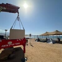 A mobile bomb shelter is installed on a beach in the southern city of Eilat, October 5, 2025. (Eilat municipality via Facebook)