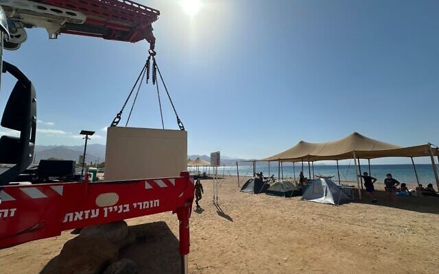 A mobile bomb shelter is installed on a beach in the southern city of Eilat, October 5, 2025. (Eilat municipality via Facebook)