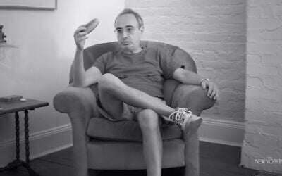 Author Gary Shteyngart holds a cucumber in the short documentary "The Man Who Got Cut Wrong." (Screenshot via 'The New Yorker' on YouTube)
