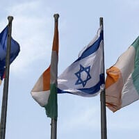 The Israeli (2R) and Irish (R) flags flutter outside the building housing the offices of the Embassy of Ireland in the central Israeli city of Tel Aviv on May 22, 2024. (JACK GUEZ / AFP)