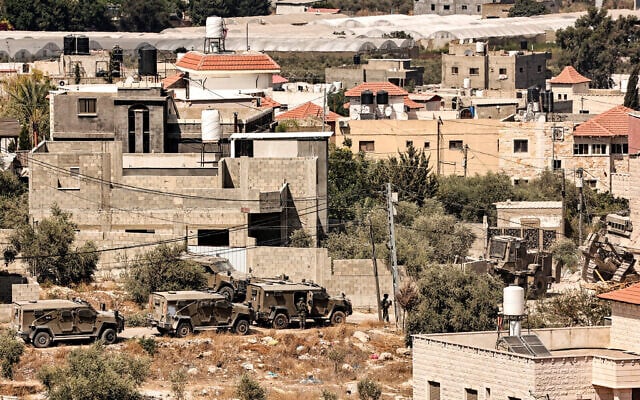 Illustrative: Israeli military vehicles deploy during a house demolition operation in the Palestinian village of Kafr Dan, west of Jenin in the West Bank, on September 3, 2024. (Photo by Zain JAAFAR / AFP) Illustrative: Israeli military vehicles deploy during a house demolition operation in the Palestinian village of Kafr Dan, west of Jenin in the West Bank, on September 3, 2024. (Photo by Zain JAAFAR / AFP)