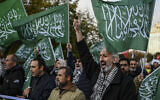 Protesters hold Hamas flags during a demonstration organized by the Gaza Solidarity Platform, against Germany's military support for Israel, in front of the German consulate in Istanbul on November 10, 2024. (KEMAL ASLAN / AFP)