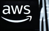 The logo of Amazon Web Services (AWS) is seen during the opening of the Hannover Messe industrial trade fair for mechanical and electrical engineering and digital industries, on March 31, 2025 in Hanover, northern Germany.  (Photo by RONNY HARTMANN / AFP)