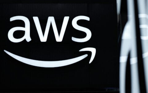 The logo of Amazon Web Services (AWS) is seen during the opening of the Hannover Messe industrial trade fair for mechanical and electrical engineering and digital industries, on March 31, 2025 in Hanover, northern Germany.  (Photo by RONNY HARTMANN / AFP)