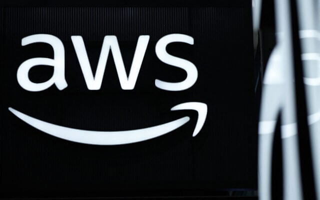 The logo of Amazon Web Services (AWS) is seen during the opening of the Hannover Messe industrial trade fair for mechanical and electrical engineering and digital industries, on March 31, 2025 in Hanover, northern Germany.  (Photo by RONNY HARTMANN / AFP)