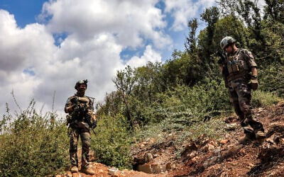 Observers of the United Nations Interim Force in Lebanon (UNIFIL) stand at a position formerly held by the Iran-backed Hezbollah terror group in the Khraibeh Valley in el-Meri in south Lebanon on August 27, 2025. (ANWAR AMRO / AFP) Observers of the United Nations Interim Force in Lebanon (UNIFIL) stand at a position formerly held by the Iran-backed Hezbollah terror group in the Khraibeh Valley in el-Meri in south Lebanon on August 27, 2025. (ANWAR AMRO / AFP)