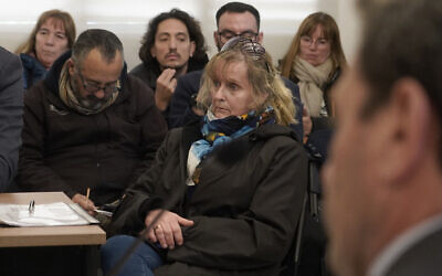 Argentine Patricia Kadgien (C), daughter of SS financial guru Friedrich Kadgien, one of several high-ranking Nazis to escape to Argentina after the war, attends a hearing after being arrested in Mar del Plata, Buenos Aires province on September 4, 2025. (AFP)