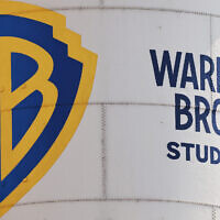 The Warner Bros. logo is displayed on a water tower at Warner Bros. Studio on September 12, 2025 in Burbank, California. (Mario Tama/Getty Images/AFP)