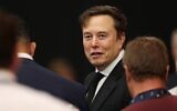 Elon Musk attends the public memorial service for slain right-wing activist Charlie Kirk at State Farm Stadium in Glendale, Arizona, on September 21, 2025. (Patrick T. Fallon / AFP)