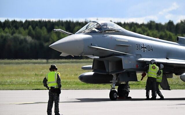 A Eurofighter Typhoon (31 04) of the German Air Force arrives at the military air base in Laage, south of Rostock, northeastern Germany, during a demonstration as part of a press day on September 23, 2025. (Tobias Schwarz / AFP)