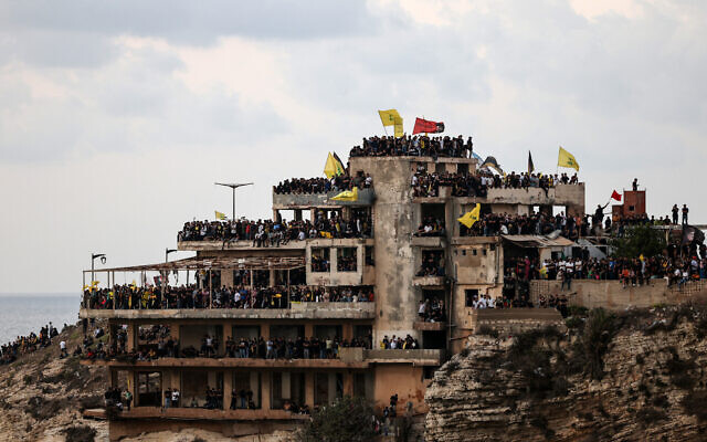 Hezbollah supporters gather in an abandoned building, as they mark the first anniversary of the killing of the party's leader Hassan Nasrallah, in Beirut's Raouche area on September 25, 2025. (ANWAR AMRO / AFP)