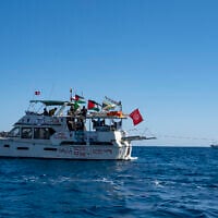 Members of the group of ships of the Global Sumud Flotilla to Gaza are seen moored at the small island of Koufonisi, south of the island of Crete, on September 26, 2025. (Photo by Eleftherios ELIS / AFP)