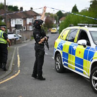 British police near the Heaton Park Hebrew Congregation synagogue in Crumpsall, north Manchester, on October 2, 2025, following a terror attack targeting the synagogue during Yom Kippur services. (Oli Scarff/AFP)