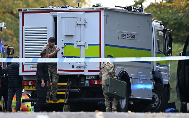 Members of the Armed Forces work at a Bomb Disposal lorry parked inside a Police cordon near the Heaton Park Hebrew Congregation synagogue in Crumpsall, north Manchester, on October 2, 2025 (Oli SCARFF / AFP) Members of the Armed Forces work at a Bomb Disposal lorry parked inside a Police cordon near the Heaton Park Hebrew Congregation synagogue in Crumpsall, north Manchester, on October 2, 2025 (Oli SCARFF / AFP)
