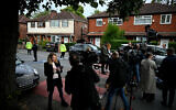 Members of the media gather by the police cordon next to Heaton Park Hebrew Congregation synagogue in Manchester on Yom Kippur, October 2, 2025, following a terrorist attack at the synagogue. (Oli Scarff / AFP)
