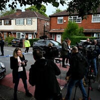 Members of the media gather by the police cordon next to Heaton Park Hebrew Congregation synagogue in Manchester on Yom Kippur, October 2, 2025, following a terrorist attack at the synagogue. (Oli Scarff / AFP)