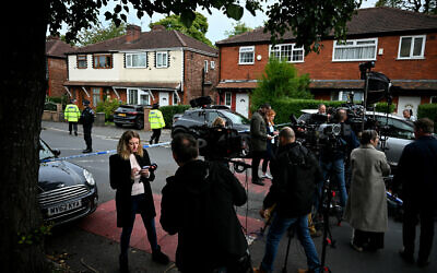 Members of the media gather by the police cordon next to Heaton Park Hebrew Congregation synagogue in Manchester on Yom Kippur, October 2, 2025, following a terrorist attack at the synagogue. (Oli Scarff / AFP)