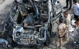 Lebanese security forces inspect a car targeted in an Israeli drone attack in the southern Lebanese village of Zebdine, on October 6, 2025. (Mahmoud Zayyat/AFP)