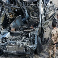 Lebanese security forces inspect a car targeted in an Israeli drone attack in the southern Lebanese village of Zebdine, on October 6, 2025. (Mahmoud Zayyat/AFP)