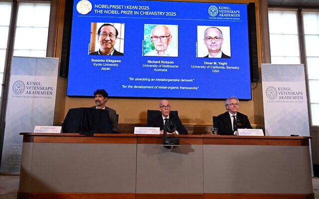 (L to R) Heiner Linke, Chair of the Nobel Committee for Chemistry, Hans Ellegren, Secretary General of The Royal Swedish Academy of Sciences, and Olof Ramstroem, Member of the Nobel Committe for Chemistry, address a press conference to announce Japan's Susumu Kitagawa, UK-born Richard Robson and American-Jordanian Omar M. Yaghi as the winners of the 2025 Nobel Prize in Chemistry at the Royal Swedish Academy of Sciences in Stockholm, Sweden, on October 8, 2025. (Jonathan Nackstrand / AFP)