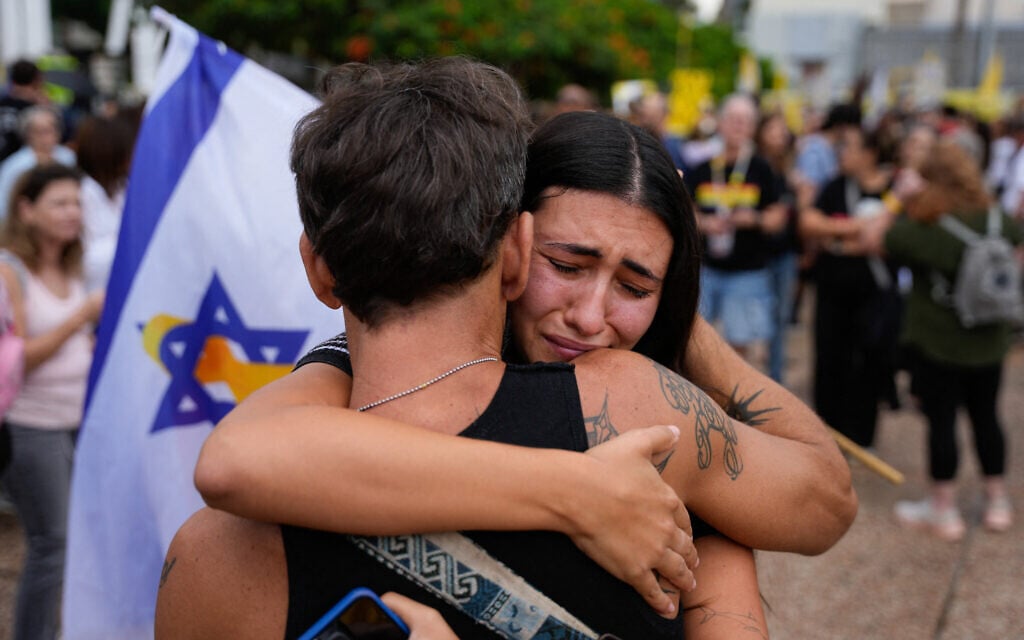People react at Hostage Square in Tel Aviv on October 9, 2025. (Maya Levin / AFP)