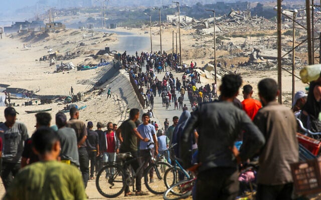 Palestinians gather on a street in Nuseirat in the central Gaza Strip on October 10, 2025. (Eyad Baba/AFP) Palestinians gather on a street in Nuseirat in the central Gaza Strip on October 10, 2025. (Eyad Baba/AFP)