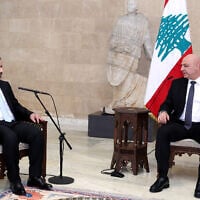 In this handout photo released by the Lebanese Presidency press office on October 10, 2025, Lebanon's President Joseph Aoun (R) speaks with Syria's Foreign Minister Asad al-Shaibani during a meeting at the presidential palace in Baabda, east of Beirut. (Lebanese Presidency / AFP)
