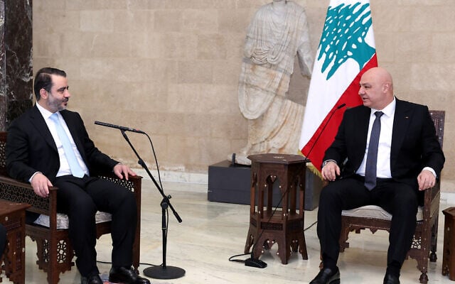 In this handout photo released by the Lebanese Presidency press office on October 10, 2025, Lebanon's President Joseph Aoun (R) speaks with Syria's Foreign Minister Asad al-Shaibani during a meeting at the presidential palace in Baabda, east of Beirut. (Lebanese Presidency / AFP)