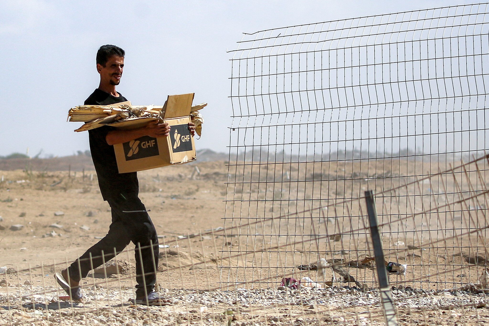 NextImg:Officials say GHF aid sites being shut down, in accordance with Gaza deal