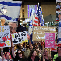 People gather at 'Hostages Square' in Tel Aviv on October 11, 2025, to celebrate the agreement signed between Israel and Hamas for a hostage-prisoner exchange deal based on a 20-point plan proposed by US President Donald Trump. (Jack GUEZ / AFP)