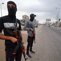 Members of the internal security forces loyal to the Palestinian terror group Hamas, man a checkpoint in the Nuseirat refugee camp in the central Gaza Strip, on October 12, 2025. (Eyad BABA / AFP)