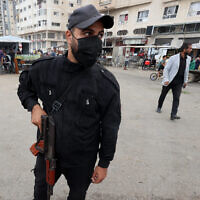 A member of the internal security forces loyal to the Palestinian terror group Hamas mans a checkpoint in the Nuseirat refugee camp in the central Gaza Strip, on October 12, 2025. (Photo by Eyad BABA / AFP)