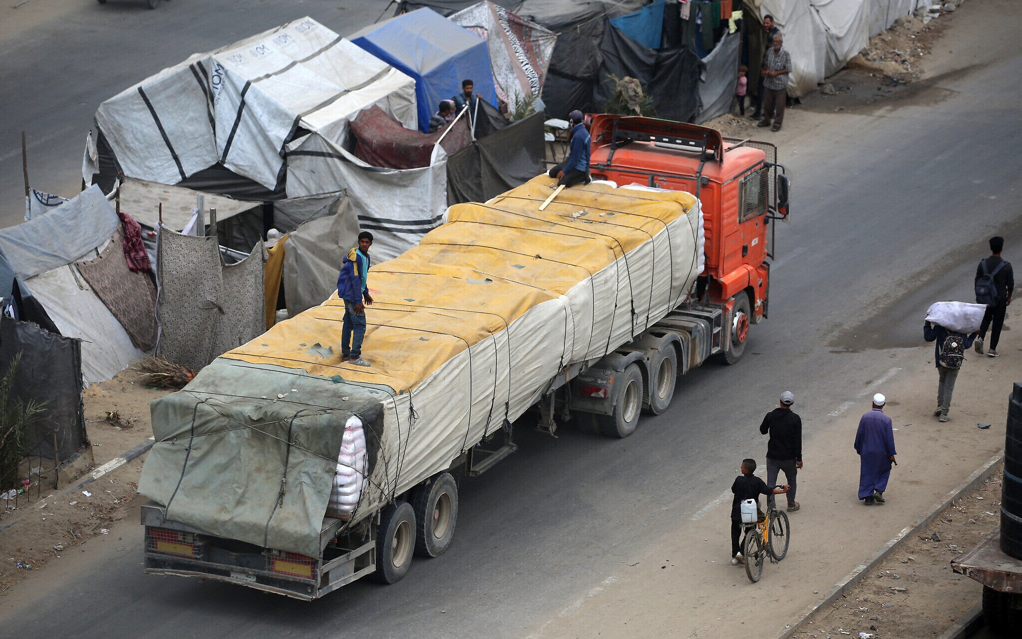 NextImg:Gaza aid deliveries appear to surge; GHF distribution sites close for hostage release
