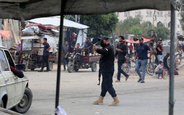 A member of the internal security forces loyal to the Palestinian terror group Hamas mans a checkpoint in the Nuseirat refugee camp in the central Gaza Strip, on October 12, 2025. (Photo by Eyad BABA / AFP) A member of the internal security forces loyal to the Palestinian terror group Hamas mans a checkpoint in the Nuseirat refugee camp in the central Gaza Strip, on October 12, 2025. (Photo by Eyad BABA / AFP)