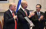 US President Donald Trump (L), Knesset speaker Amir Ohana (C) and President Isaac Herzog at the Knesset, in Jerusalem on October 13, 2025 (Kenny HOLSTON / POOL / AFP)