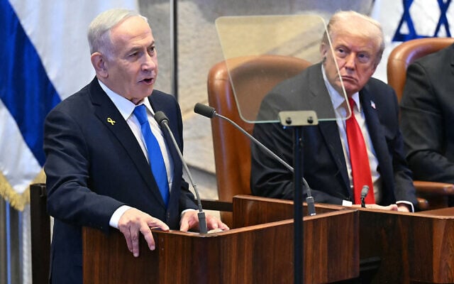 US President Donald Trump (R) listens to Prime Minister Benjamin Netanyahu as he addresses the Knesset, in Jerusalem on October 13, 2025 (SAUL LOEB / POOL / AFP)