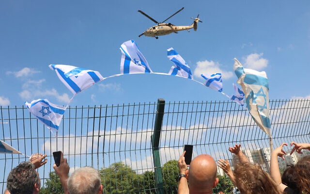 An Israeli military helicopter prepares to land as it transports a released Israeli hostage to the Beilinson Hospital in the Rabin Medical Centre in Petah Tikva in central Israel on October 13, 2025.  (Photo by GIL COHEN-MAGEN / AFP)